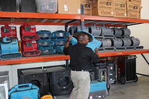 Water Damage Edwards Technician Mobilizing Air Movers