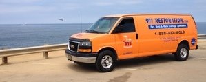 Water and Mold Damage Restoration Van Driving To Job Site