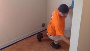 Technician Doing An Inspection In A Flooded Home